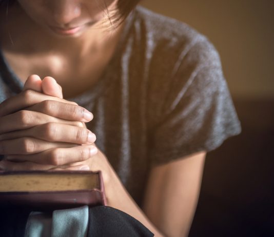 A woman praying.