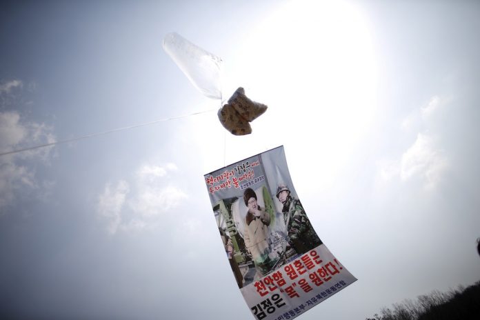 A balloon containing leaflets denouncing North Korean leader Kim Jong Un is seen near the demilitarized zone separating the two Koreas in Paju, South Korea, March 26, 2016. (Photo by Kim Hong-Ji/Reuters)