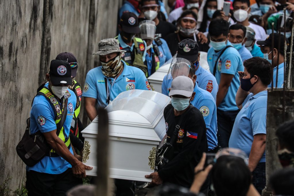 Hundreds of mourners join the funeral march for mother and son Sonia and Frank Anthony Gregorio who were laid to rest in the town of Paniqui in Tarlac province in Dec. 27. (Photo by Jire Carreon)