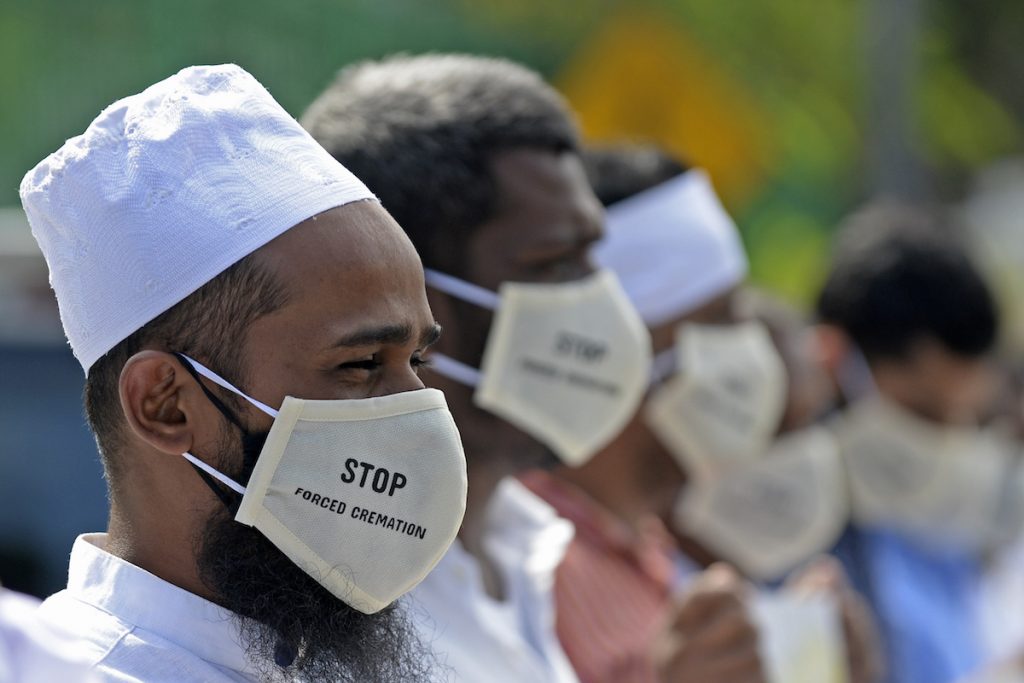 In this file photo taken on Dec. 23, 2020 protesters take part in a demonstration against the Sri Lankan government policy of forced cremations of Muslims who die of the COVID-19 outside a cemetery in Colombo. (Photo by Lakruwan Wanniarachchi/AFP)