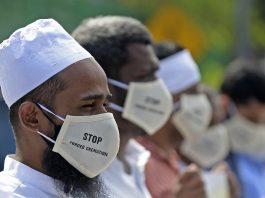 In this file photo taken on Dec. 23, 2020 protesters take part in a demonstration against the Sri Lankan government policy of forced cremations of Muslims who die of the COVID-19 outside a cemetery in Colombo. (Photo by Lakruwan Wanniarachchi/AFP)