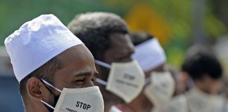 In this file photo taken on Dec. 23, 2020 protesters take part in a demonstration against the Sri Lankan government policy of forced cremations of Muslims who die of the COVID-19 outside a cemetery in Colombo. (Photo by Lakruwan Wanniarachchi/AFP)