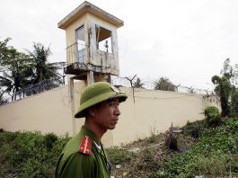 A file image of a Vietnamese policeman standing watch outside the Phuoc Co jail on the outskirts of the southern coastal town of Vung Tau. (Photo by Hoang Dinh Nam/AFP)