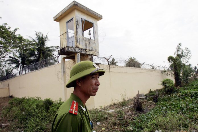 A file image of a Vietnamese policeman standing watch outside the Phuoc Co jail on the outskirts of the southern coastal town of Vung Tau. (Photo by Hoang Dinh Nam/AFP)