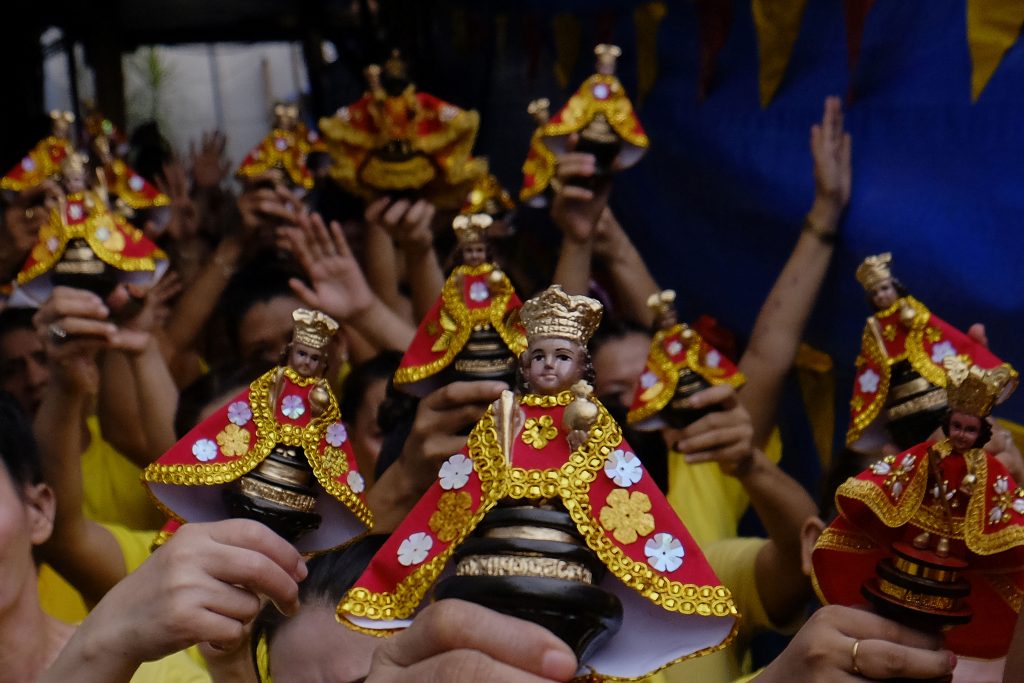 Devotees of the Child Jesus raise images of the Santo Niño in the central Philippine province of Cebu during the annual feast in 2018. (File photo by Victor Kintanar)