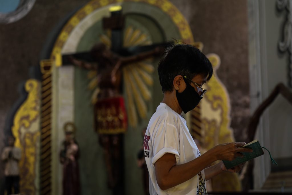 A woman lector reads the day’s readings during Mass at the San Felipe Neri Church in Mandaluyong City, Philippines, in April 8, 2020. (Photo by Jire Carreon)
