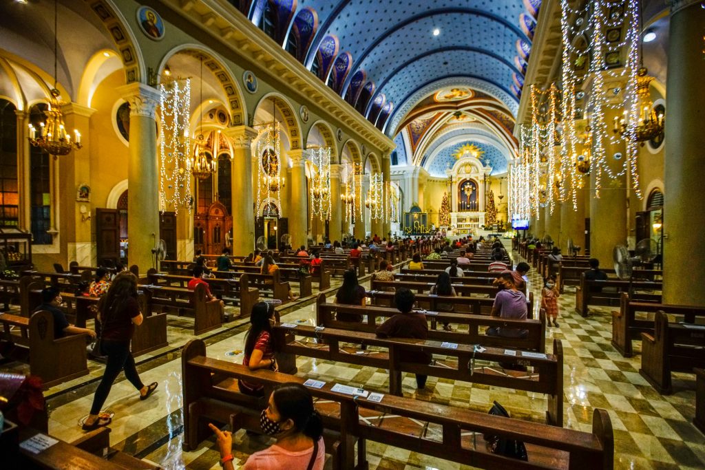Churchgoers wear face masks and shields and observe physical distancing protocols during Mass at the Immaculate Concepcion Cathedral in Cubao, Quezon City. (Photo by Jire Carreon)