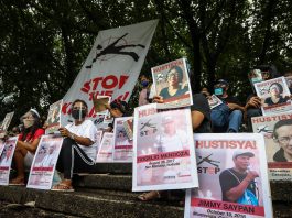 Human rights groups display photographs of activists who were reported killed in the Philippines in recent months during a demonstration in Quezon City on Aug. 19, 2020. (Photo by Jire Carreon)