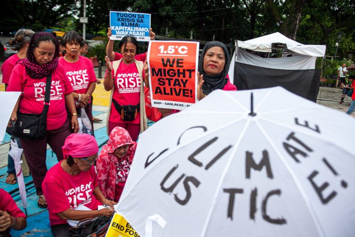 Climate activists stage a demonstration in Manila to call for climate justice in this photograph taken in 2020. (Photo by Mark Saludes)