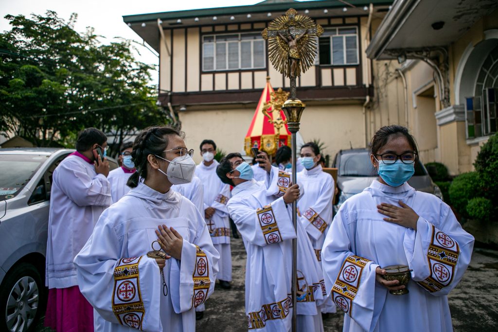 Women acolytes prepare for the celebration of the Holy Eucharist at the Minor Basilica de San Pedro in Quezon City, Philippines, in September 2020. (Photo by Mark Saludes)