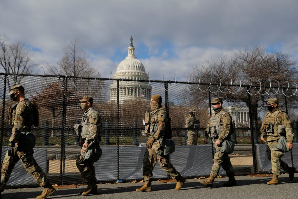 Members of the National Guard patrol near the U.S. Capitol building ahead of U.S. President Joe Biden's inauguration, in Washington, D.C., Jan. 19, 2021. (Photo by Andrew Kelly / Reuters)