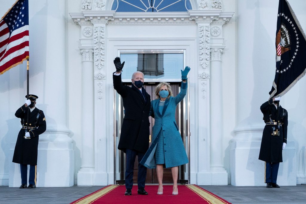 US President Joe Biden and First Lady Jill Biden wave as they arrive at the North Portico of the White House in Washington, D.C., on Jan. 20, 2021. (Photo by Alex Brandon / Pool via Reuters)