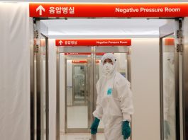 A medical worker checks the doors inside the Mobile Clinic Module outside Korea Cancer Center Hospital in Seoul, South Korea, Jan. 8. (Photo by Heo Ran/Reuters)