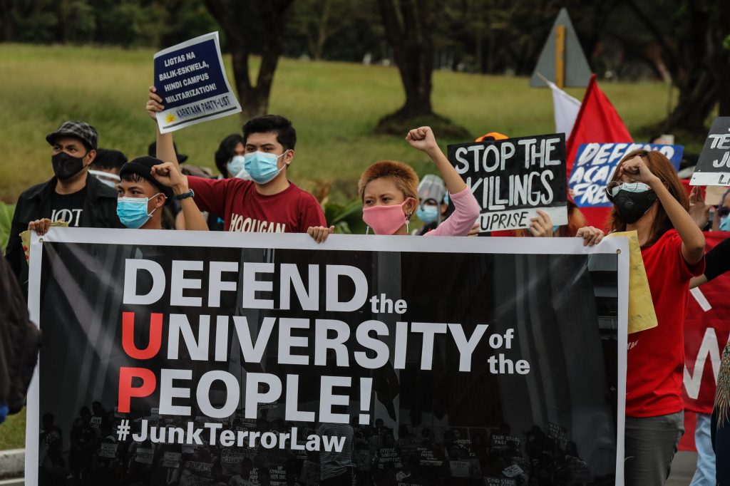 University of the Philippines students, faculty, and members of the academic community hold a demonstration inside the school campus in Quezon City on Jan. 19, 2021, to oppose the proposed abrogation of an agreement between the university and the Defense department. (Photo by Jire Carreon)