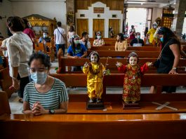 Images of the Santo Niño or the Child Jesus are brought to a church in Quezon City during its ‘feast’ on Jan. 17, 2021. (Photo by Mark Saludes)