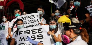 Activists stage a demonstration in Manila on January 29, 2021, to call for sufficient healthcare services, including mass testing for COVID-19 and adequate protection for medical workers. (Photo by Basilio Sepe)