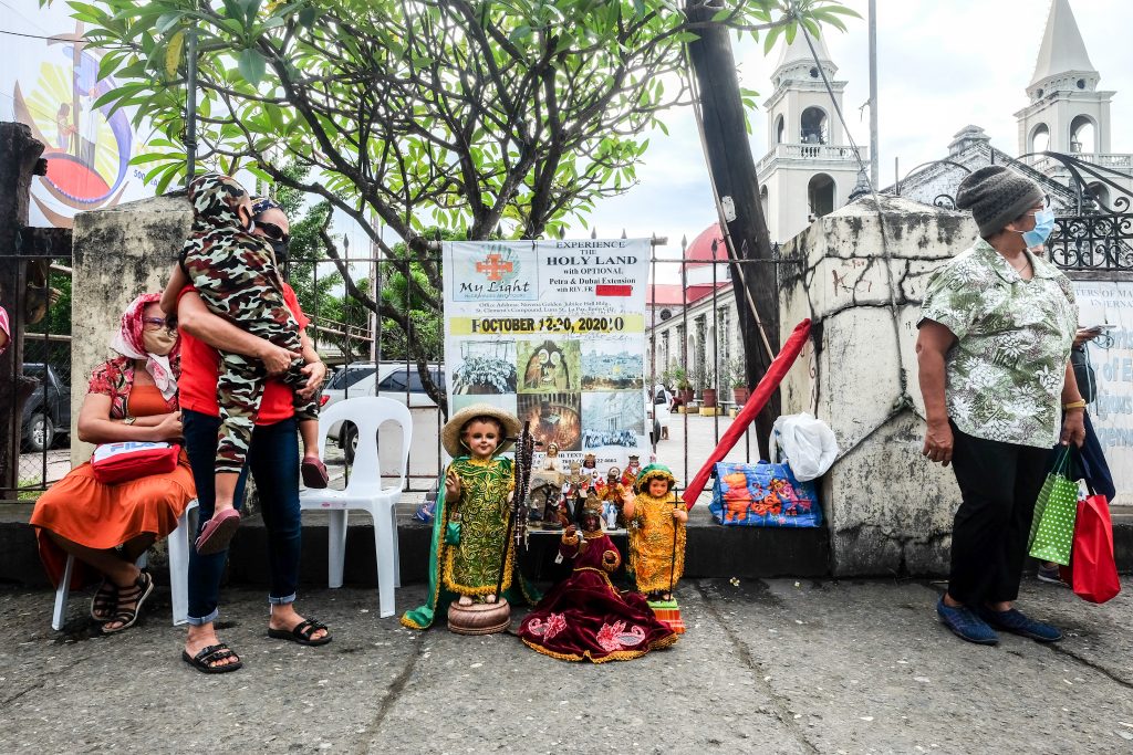Devotees of the Child Jesus in Iloilo City guard their images of the Santo Niño while awaiting for the parade of images on January 24. (Photo by Marielle Lucenio)