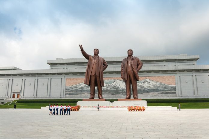 Bronze sculptures of North Korean despots Kim Il-sung and Kim Jong-il in Pyongyang. (Photo by Piu Piu/shutterstock.com)