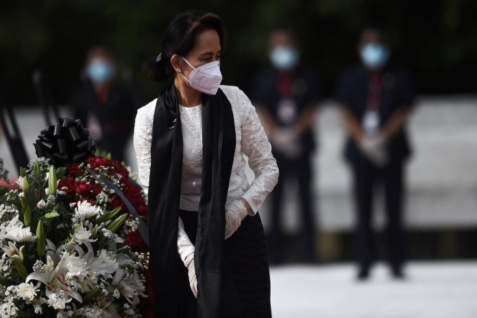 Myanmar State Counsellor and Foreign Minister Aung San Suu Kyi leaves after paying her respects to her late father during a ceremony to mark the 73rd anniversary of Martyrs' Day in Yangon on July 19, 2020. (Photo by Ye Aung Thu/Reuters)