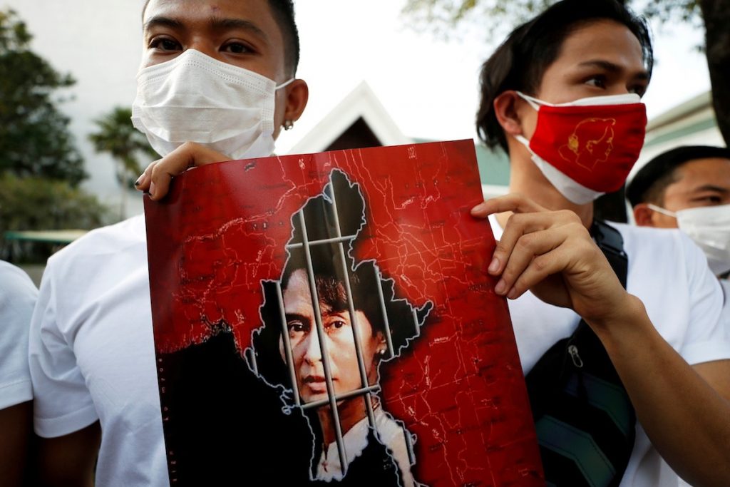 Myanmar citizens hold up a picture of leader Aung San Suu Kyi after the military seized power in a coup in Myanmar, outside United Nations venue in Bangkok, Thailand Feb. 2. (Photo by Jorge Silva/Reuters)