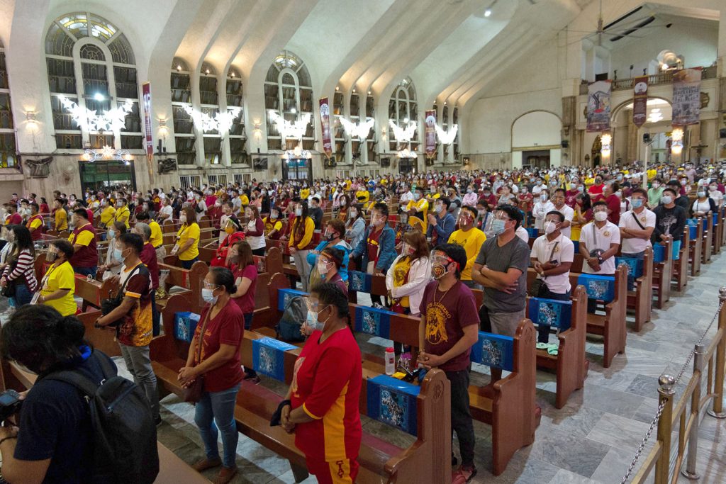 Devotees wear masks and face shields during Mass to celebrate the Feast of the Black nazarene at Quiapo Church in Manila on Jan. 9, 2021. (CBCP News photo)
