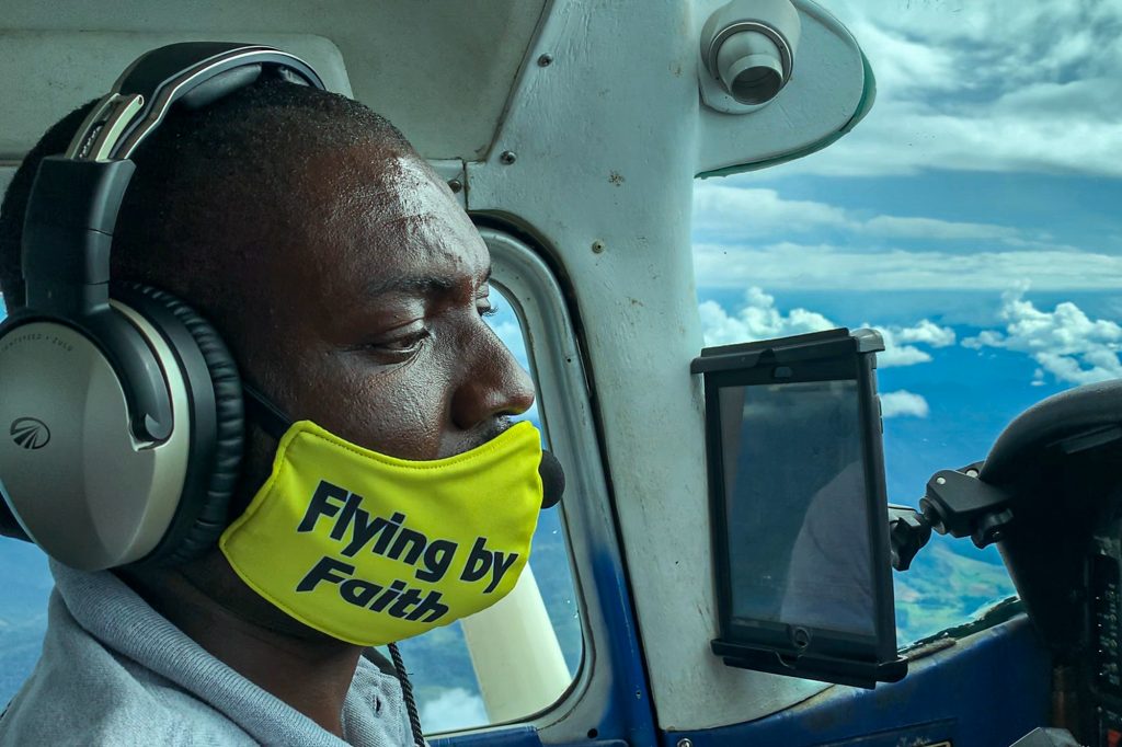 Pilot Davin Bennett of the Philippine Adventist Medical Aviation Services in one of his missionary flights. (Photo by Mark Saludes)