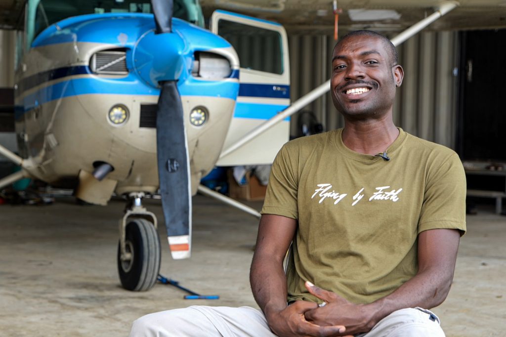 Pilot Davin Bennett of the Philippine Adventist Medical Aviation Services poses for a photograph with his four-seater Cessna 172 plane. (Photo by Mark Saludes)