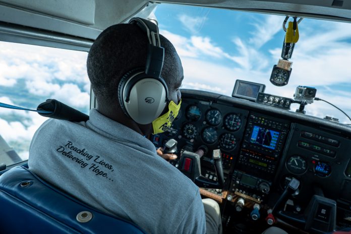 Pilot Davin Bennett of the Philippine Adventist Medical Aviation Services flies a missionary flight over in the northern Philippines. (Photo by Mark Saludes)