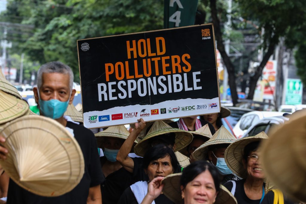 IN PHOTOS Filipino climate activists march against fossil fuel