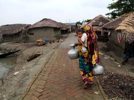 A woman fetching water in Bangladesh, poverty