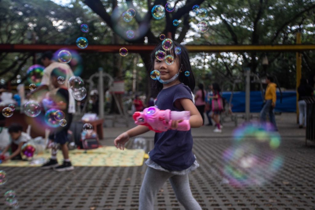 Girl playing with bubble