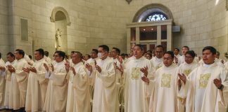 Priests who carry us