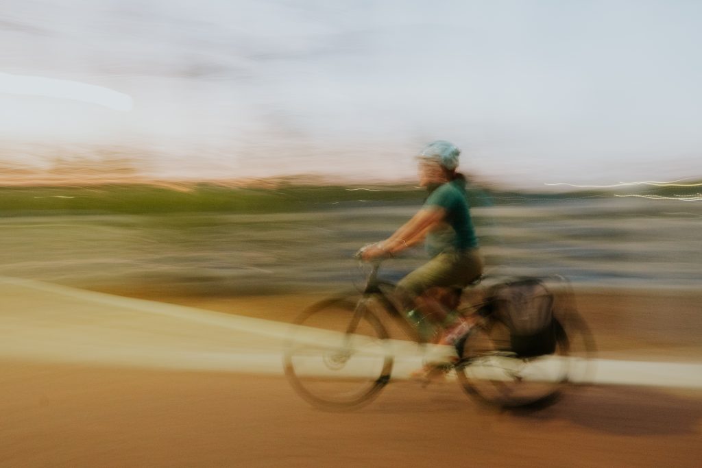 Female cyclist in the Philippines in a blurry photo