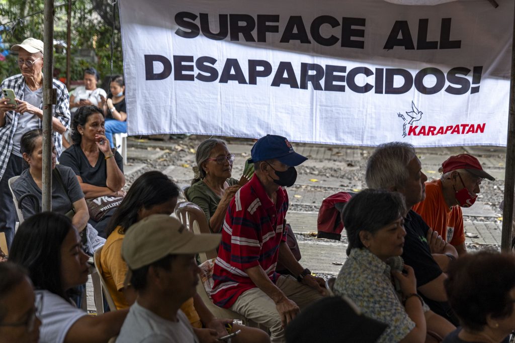 PHOTOS With no tombs to visit, families of Desaparecidos gather on All