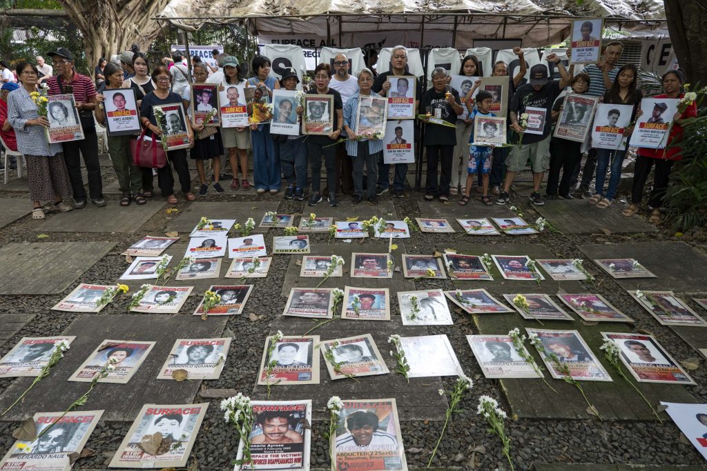 PHOTOS With no tombs to visit, families of Desaparecidos gather on All